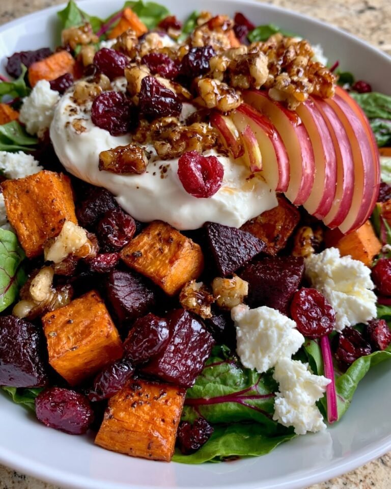 Roasted Sweet Potato and Beet Salad with creamy burrata, sliced red apples, dried cranberries, candied walnuts, goat cheese, and fresh greens.