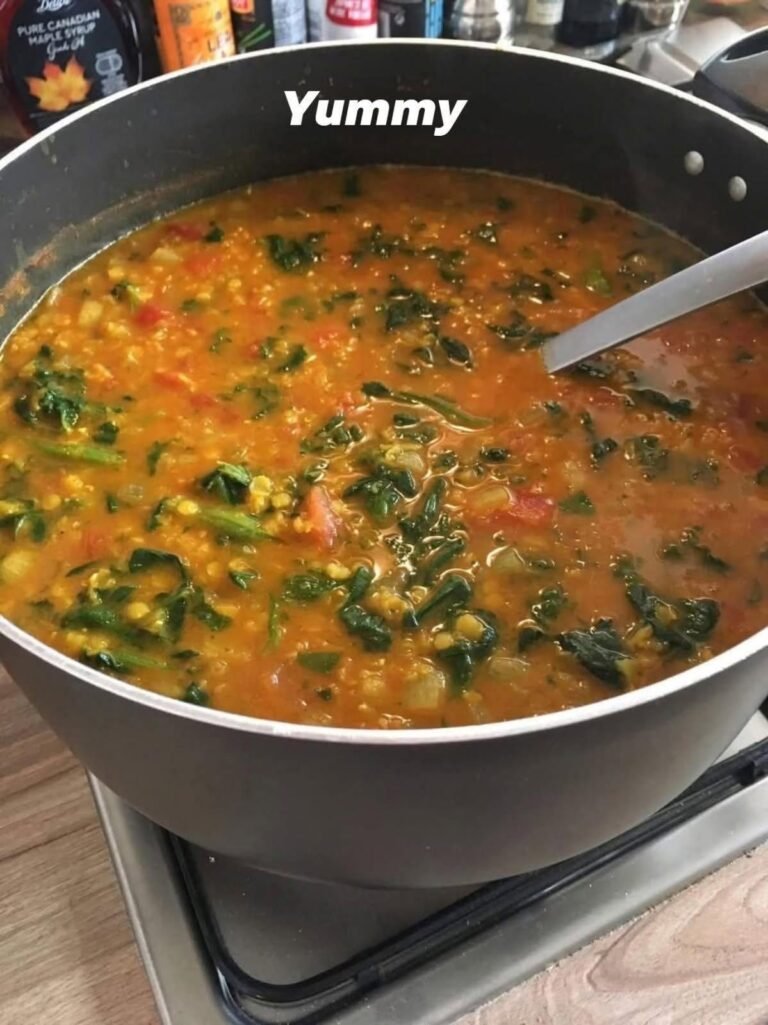 Healthy 1-Point Lentil Soup with tender lentils, carrots, celery, tomatoes, spinach, and fresh parsley in a ceramic bowl.