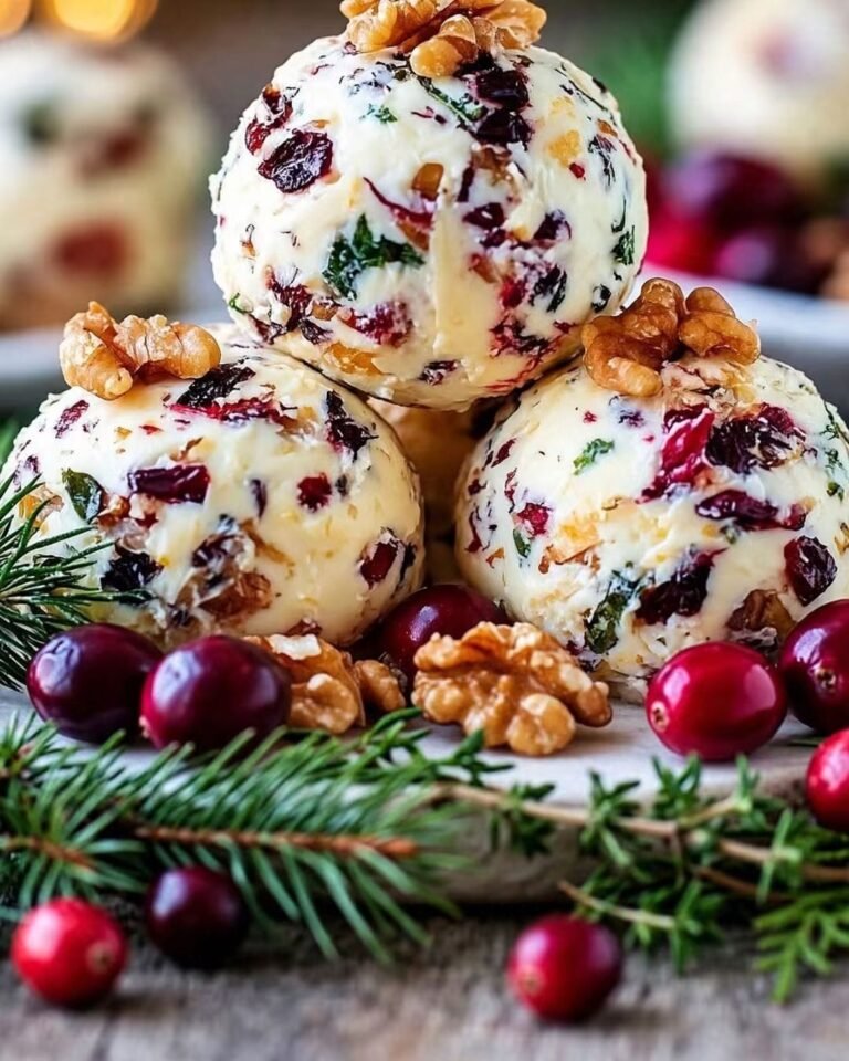 Cranberry Cheese Balls with cream cheese, cheddar, dried cranberries, walnuts, fresh herbs, and a festive holiday coating