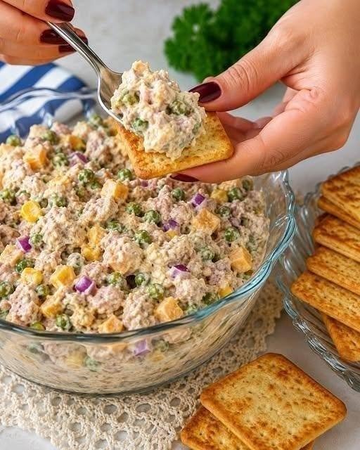 Tuna Salad Dip with Greek yogurt, lemon, herbs, celery, crackers, and Mediterranean toppings